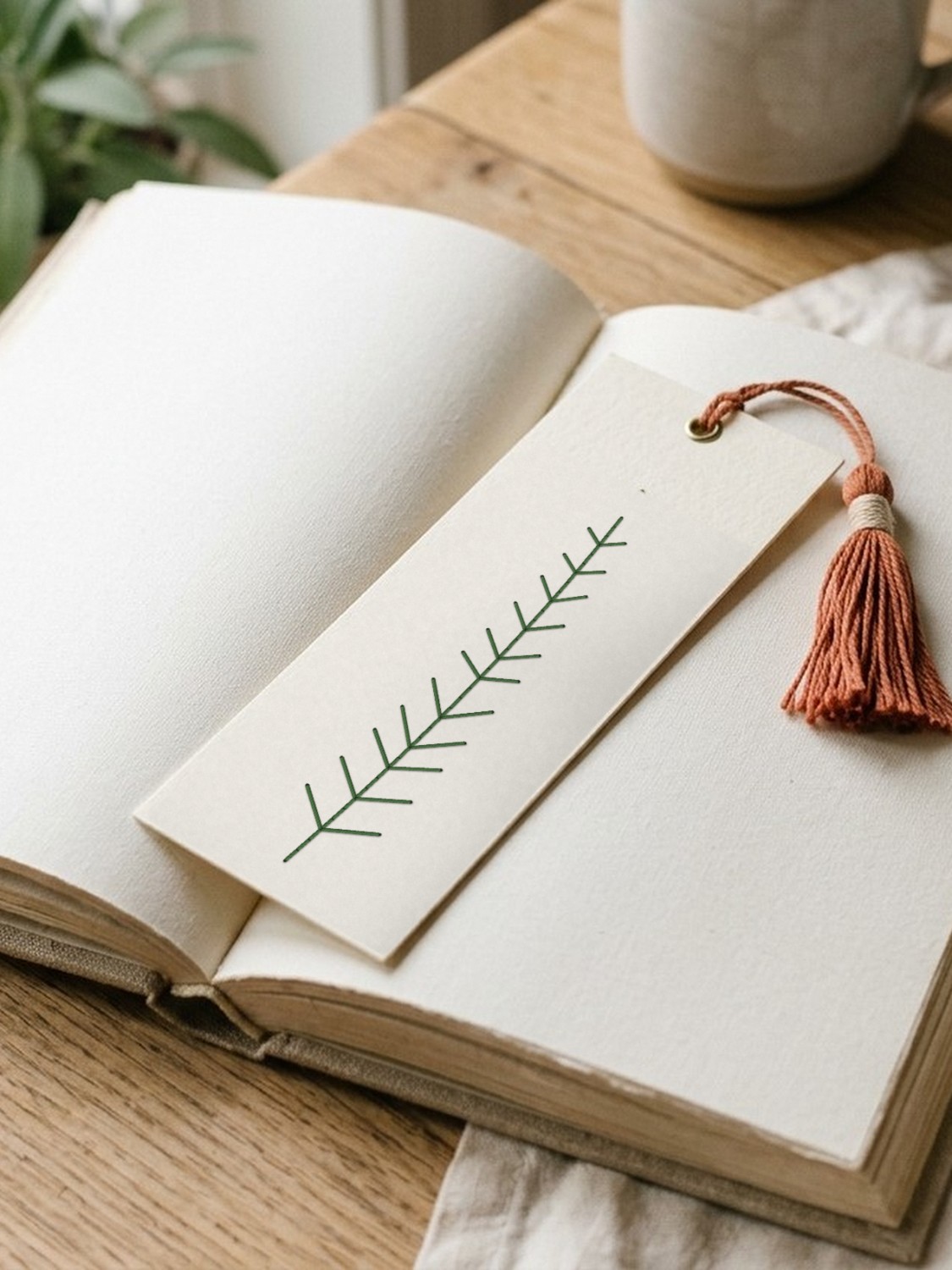 Fern frond bookmark with a thread tassel